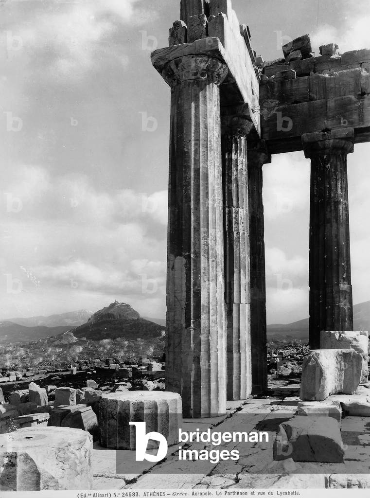 The exterior columns of the Parthenon and the Lykabettos Hill in Athens