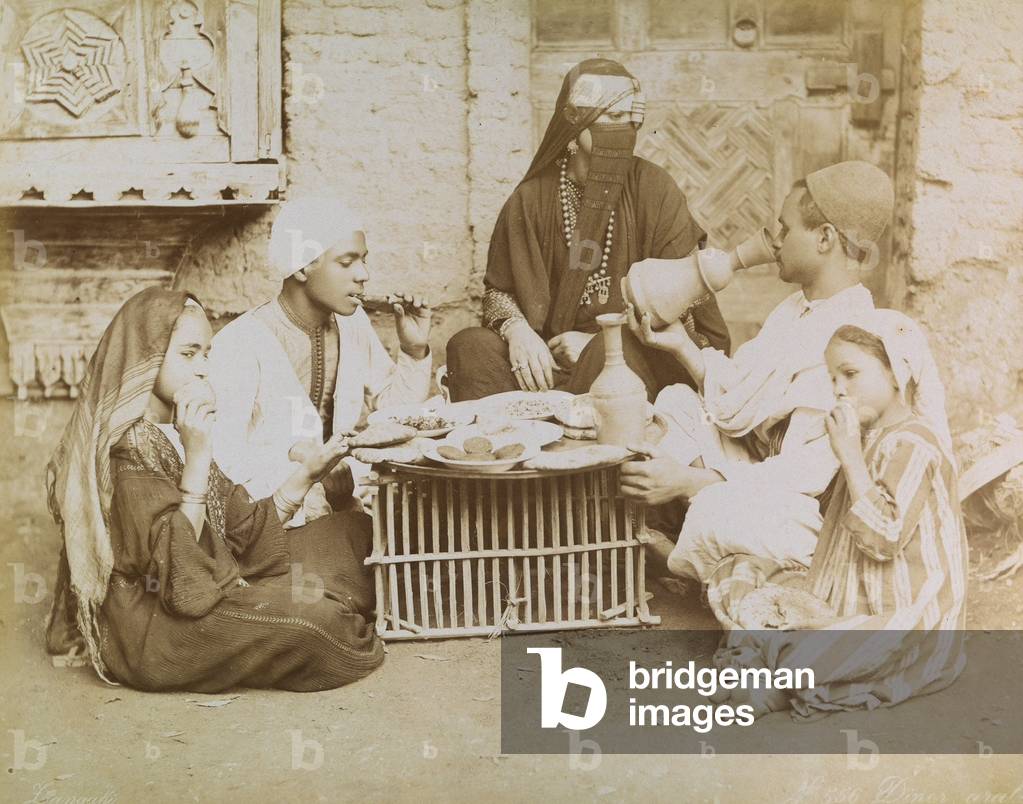Arab family photographed during dinner, 1885 (print on double-weight paper)