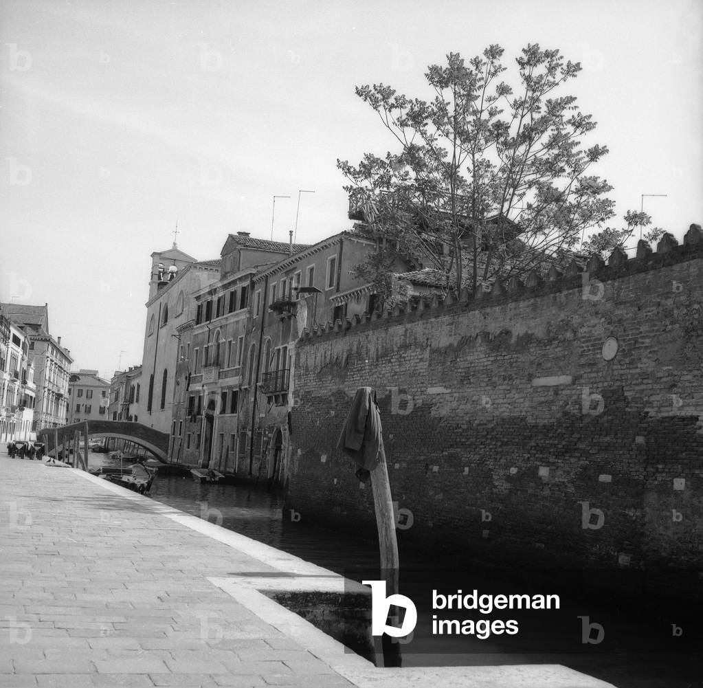 View of a canal in Venice (b/w photo)