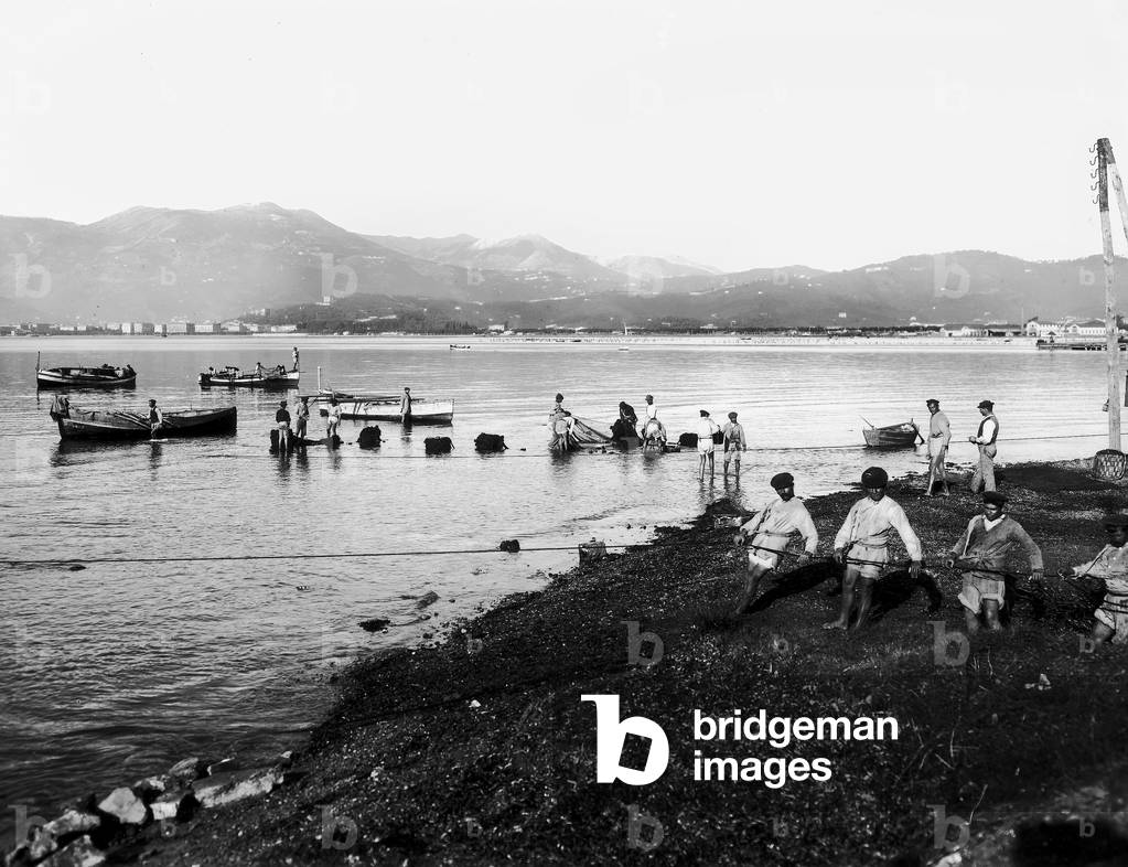 View of a group of fishermen at work in the Golf of La Spezia