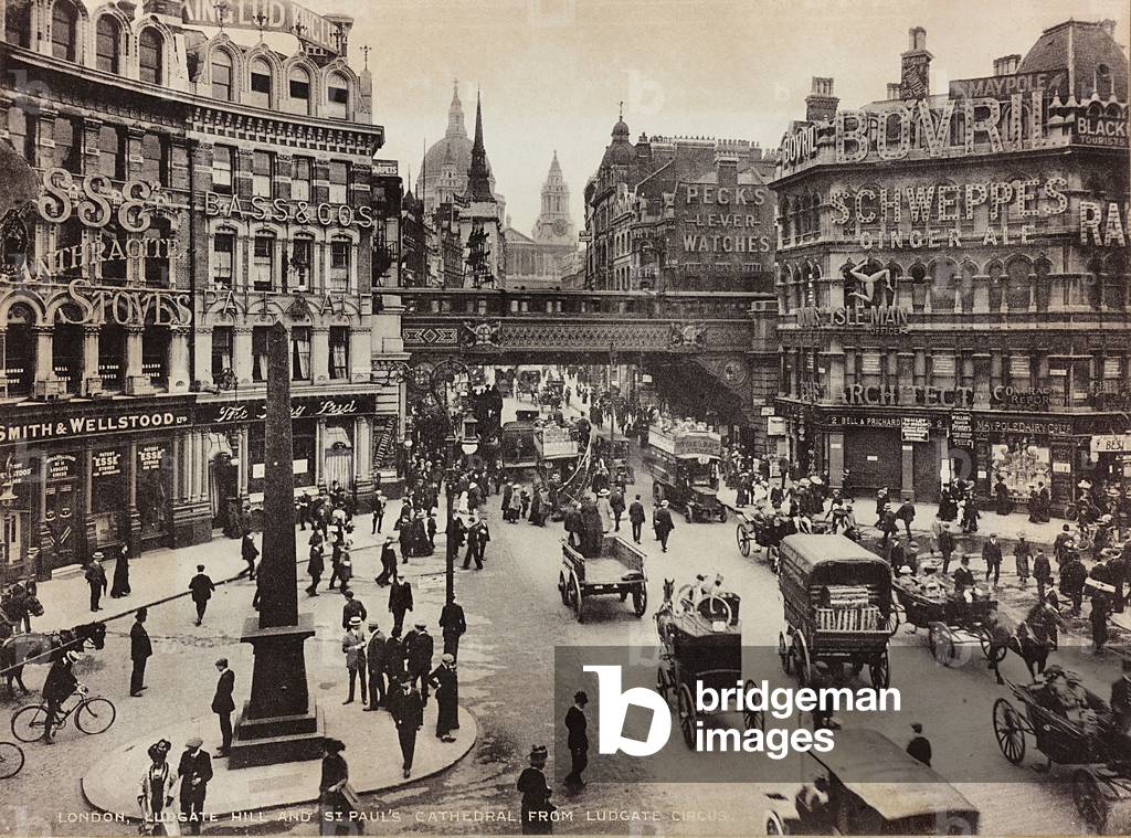 Busy view of Ludgate Circus in London. In the background the Cathedral of Saint Paul