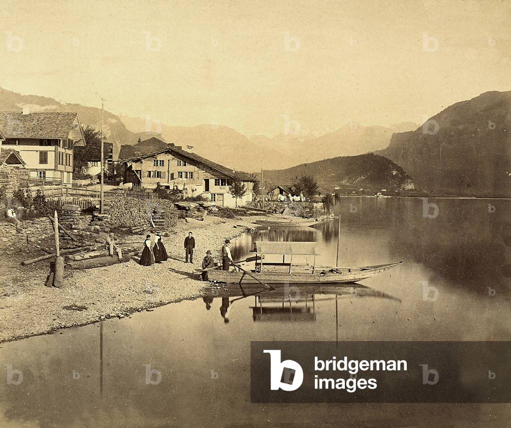 Health resort on Lake Brienz, in Switzerland. A few people are standing on the shore