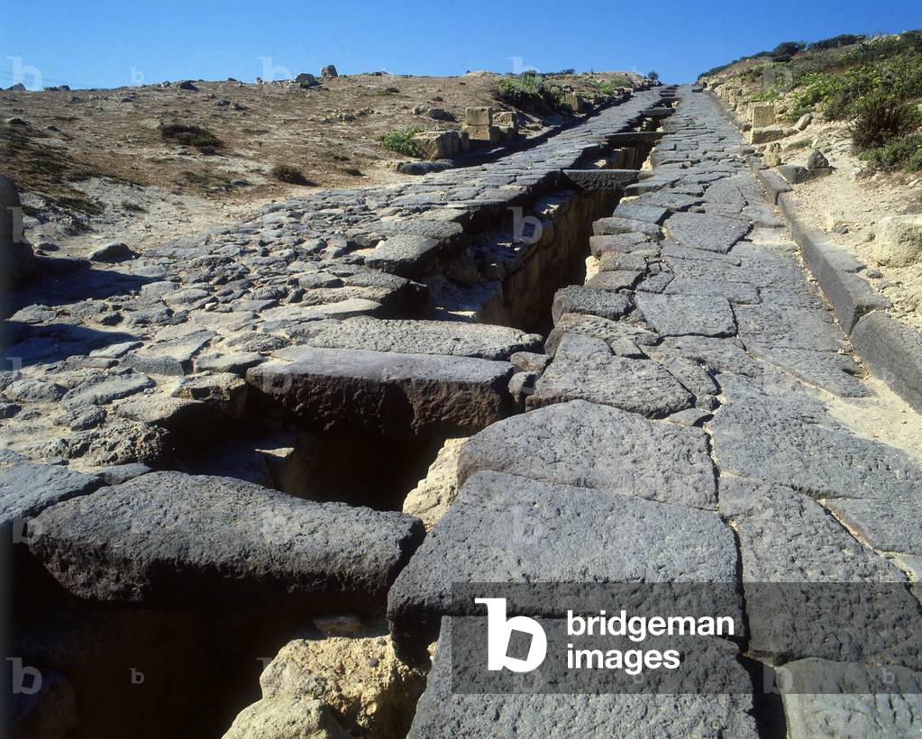 A paved road of the Poenician-Punic and Roman settlement of Tharros in the province of Oristano