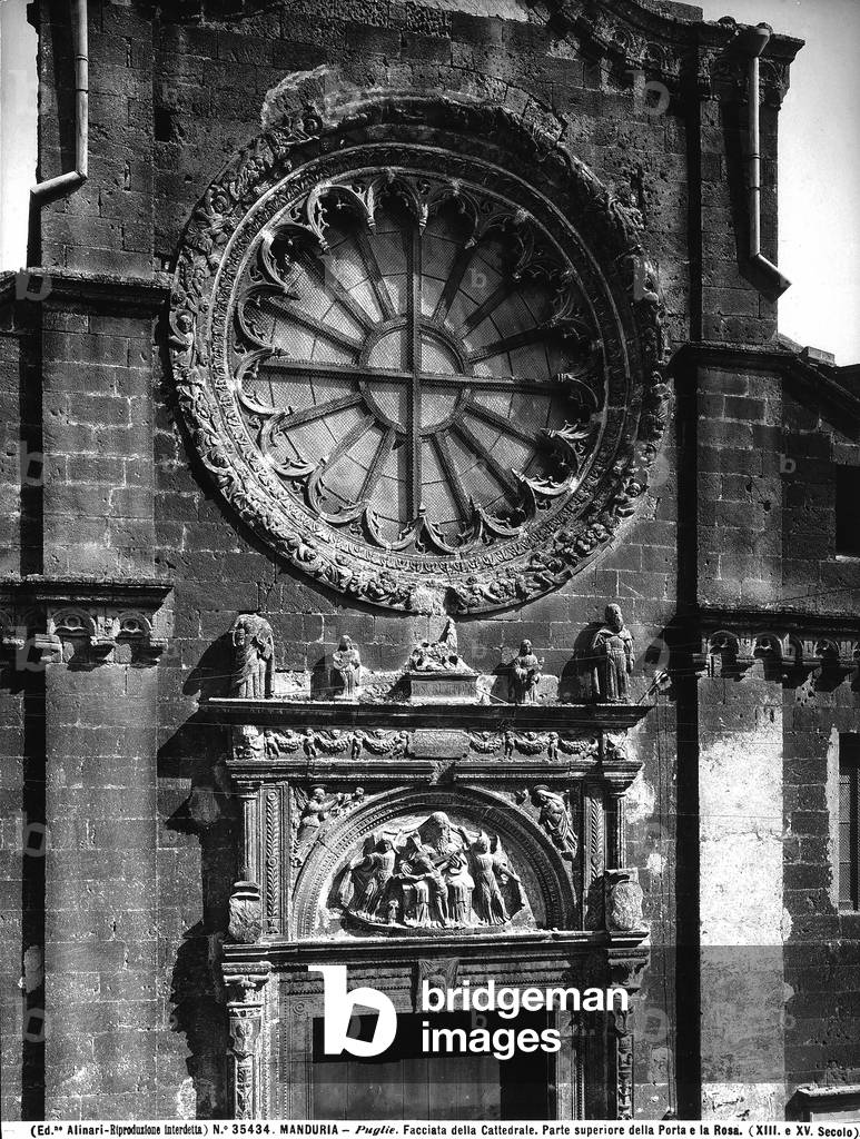 Detail of the façade of the cathedral of Manduria, with the rose and the upper part of one of the three Renaissance portals