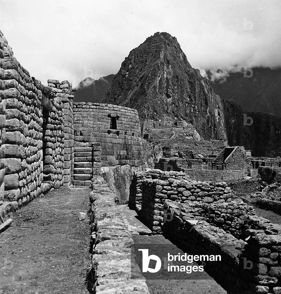 Ruins of the houses of the Lost City of the Incas, and the Sun Temple, Machu Picchu, Peru