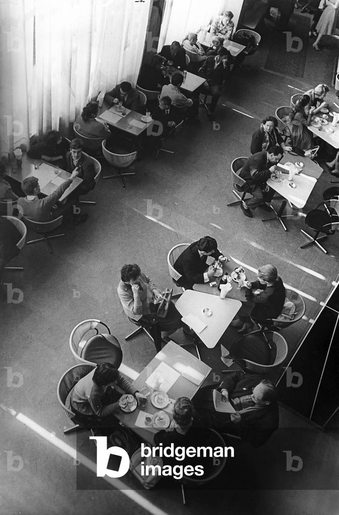 Moments of relaxation at the tables of a caffé on Gorki Street, in Moscow, Russia