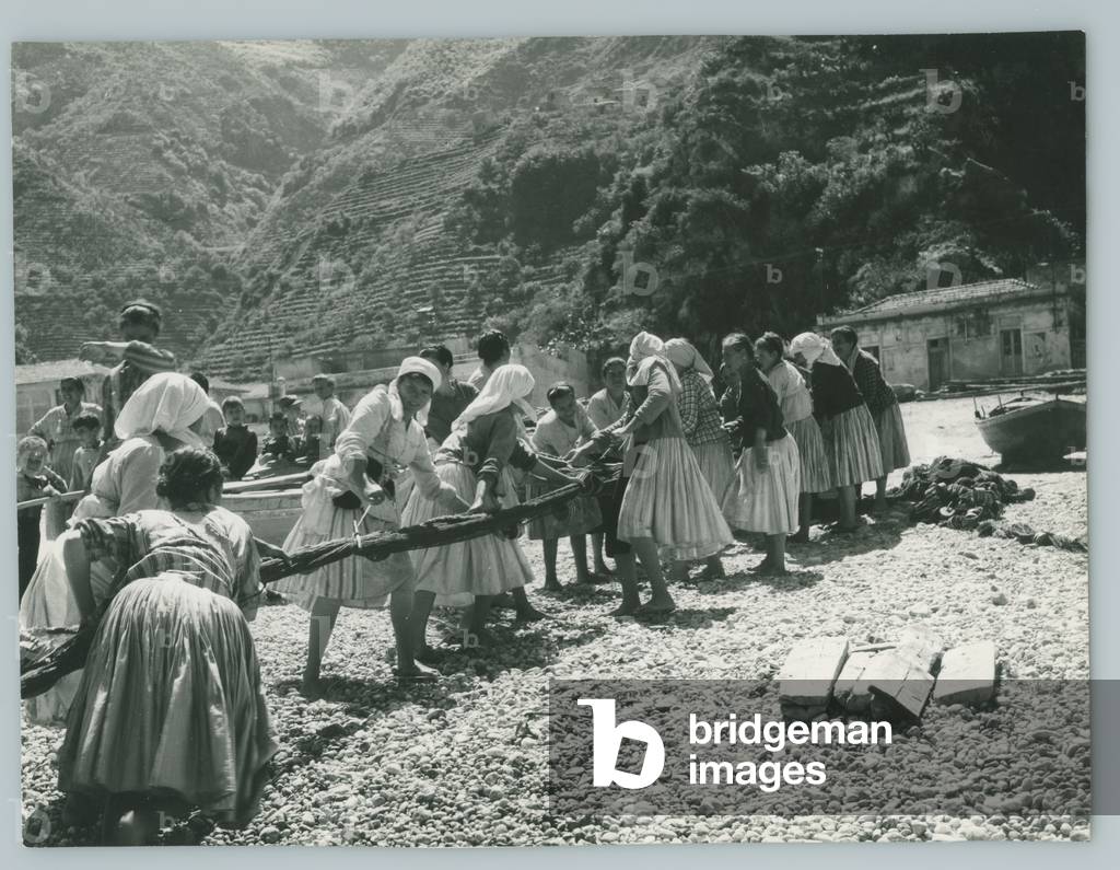 Bagnara Calabrian women on a beach with fishing nets, Calabria, Italy, 1966 (b/w photo)