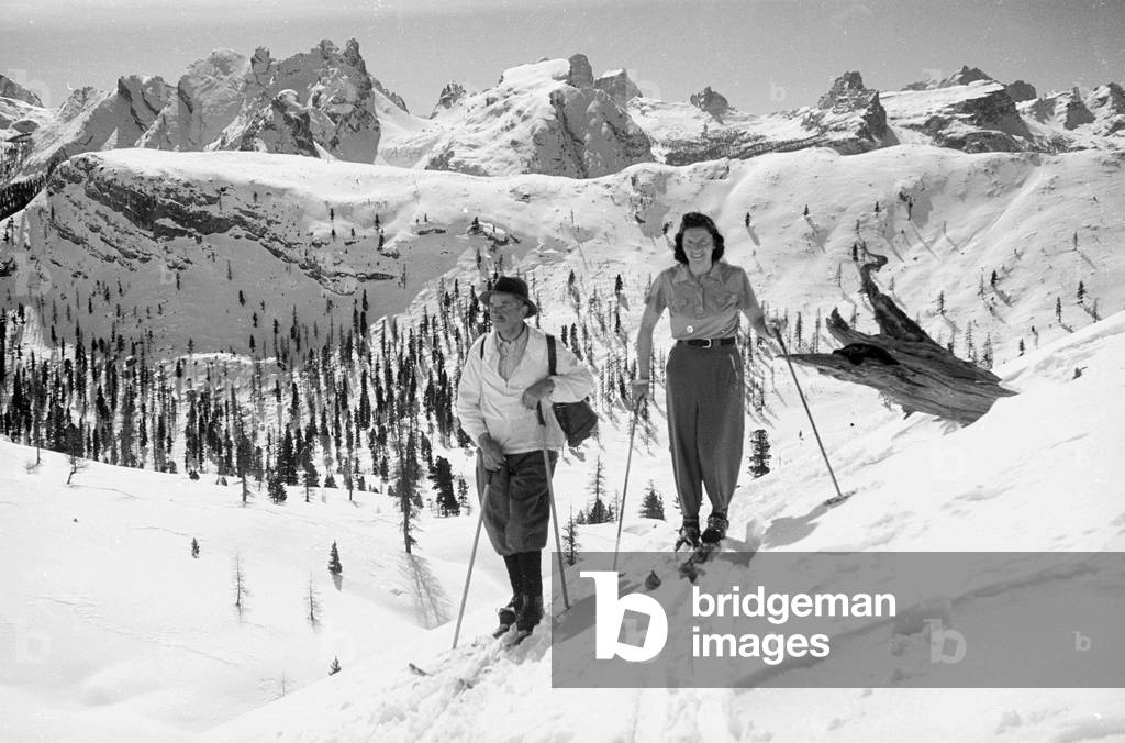 Portrait of a couple on the skis in a snowy mountain landscape, Cortina d'Ampezzo