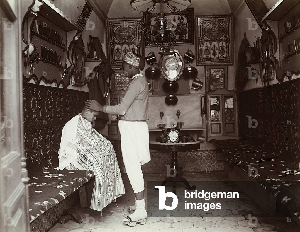 A Turkish barber and his client in his shop, 1890 (print on double-weight paper)