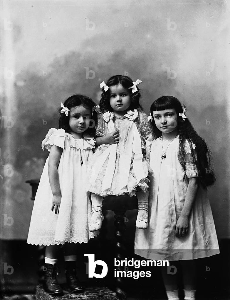 Portrait in studio of three children