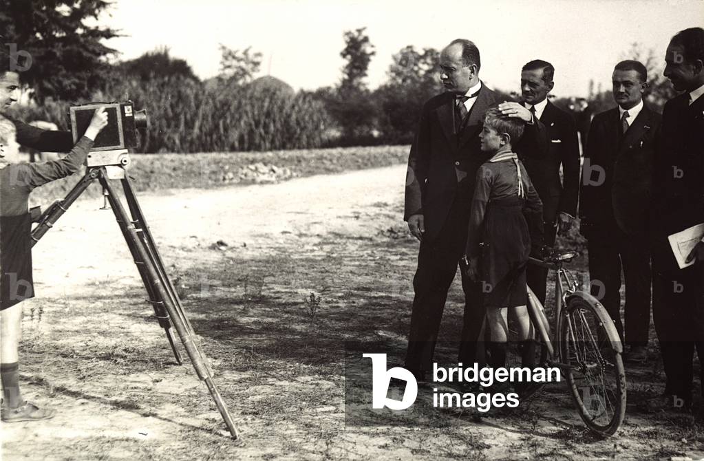 Mussolini posing with his son for a photographer (b/w photo)
