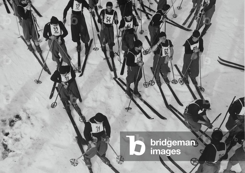 Fascist boys on the snow fields, during a break. Each of them has a number, as a sign of their participation in a competition, Italy, c.1929-39 (gelatin silver print)