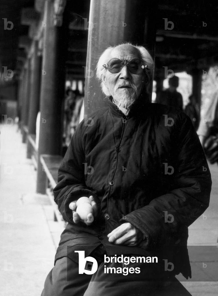Portrait of an elder in the Gallery of Love in the Summer Palace in Beijing (b/w photo)