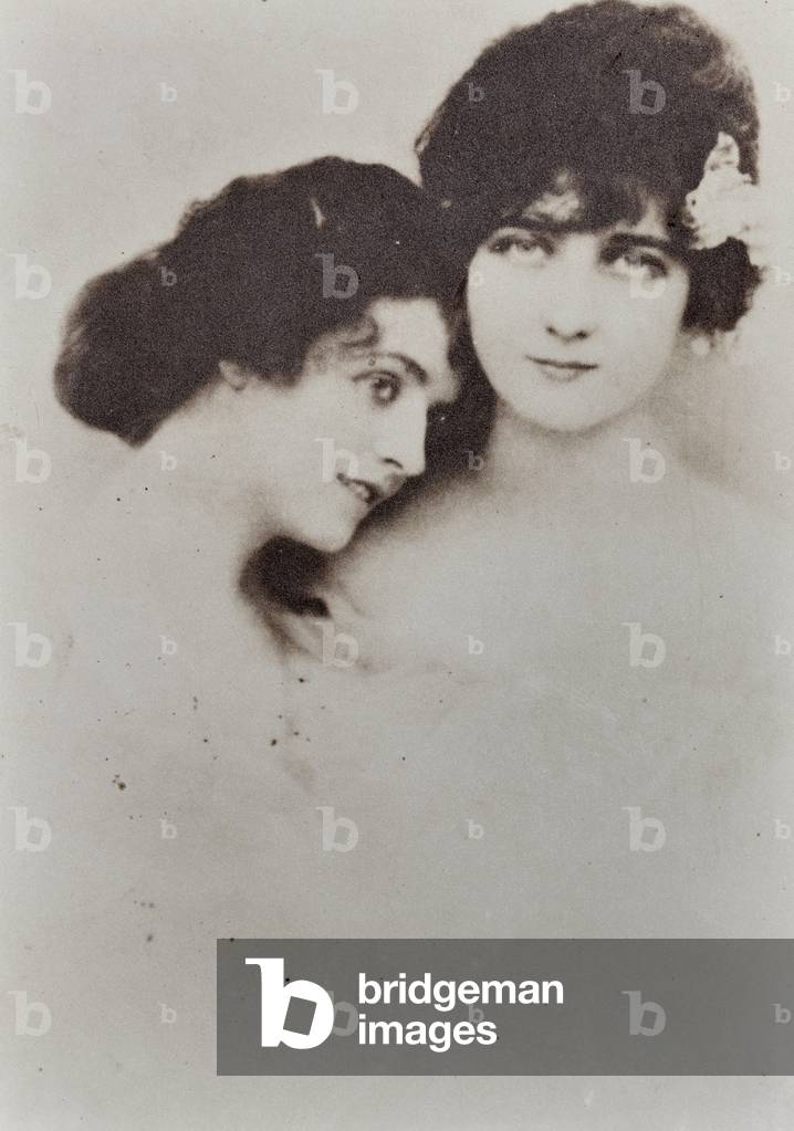 Half-length portrait of two young women in an affectionate pose.