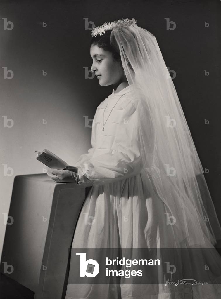 Portrait of child with formal wear for Communion