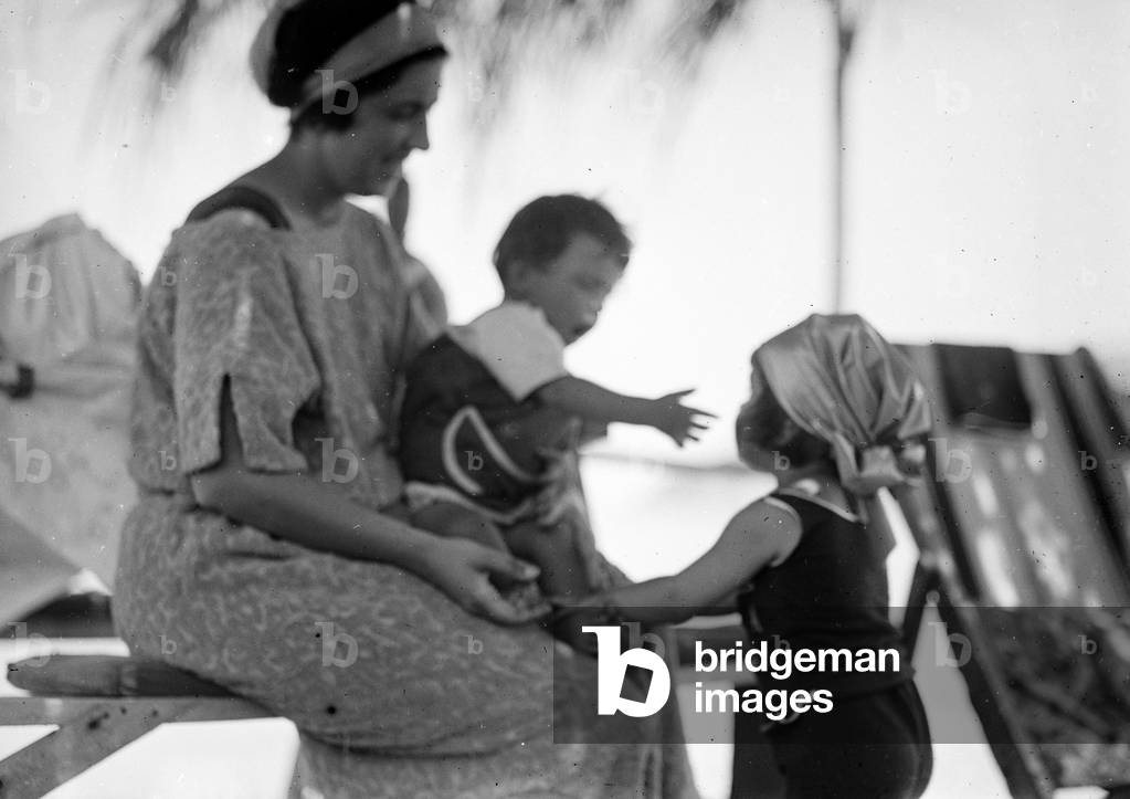 Portrait of a woman with two children