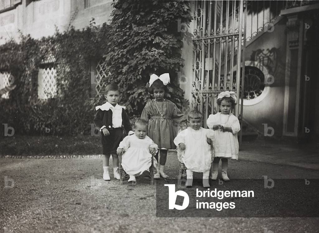 Group of children in the garden of a villa (b/w photo)