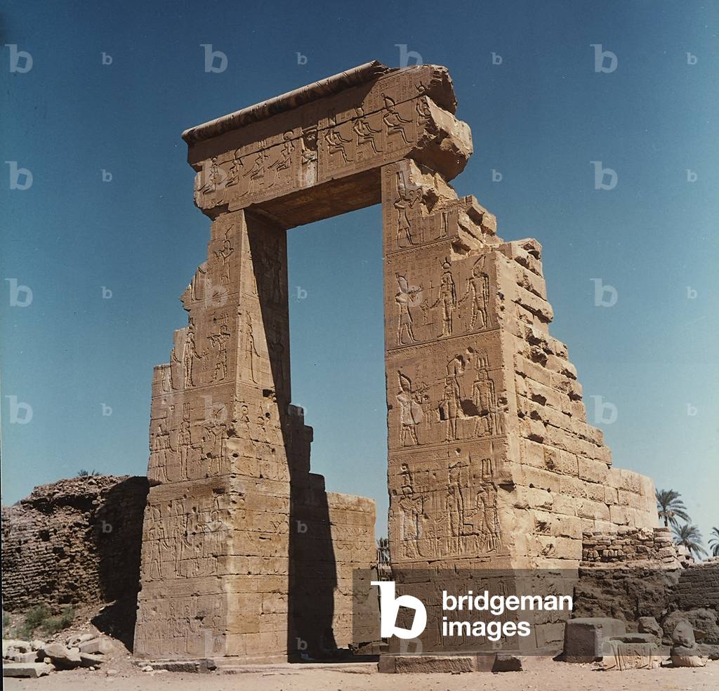 The northern portal of the sacred wall of Dendera, in Upper Egypt. The portal, from which the Temple of Hathor was reached, is ornamented with reliefs of Egyptian gods
