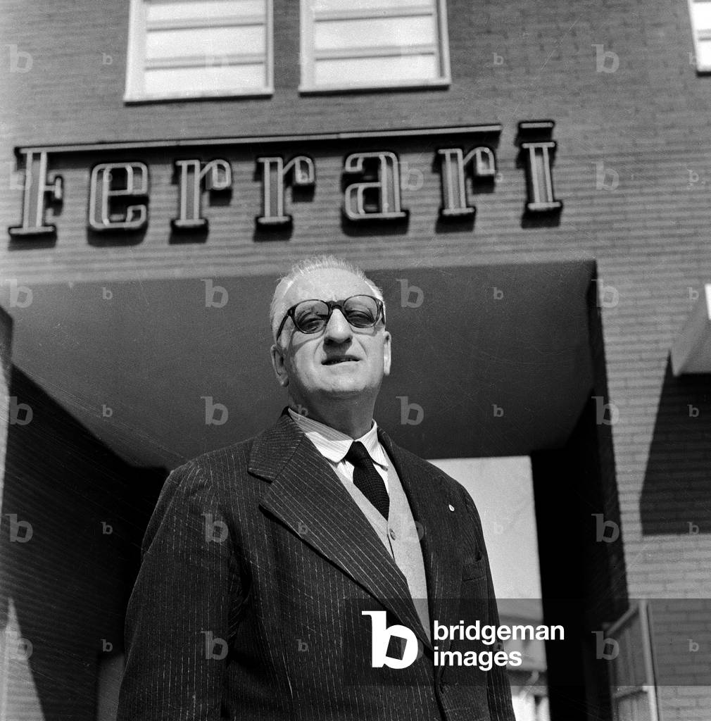 Enzo Ferrari in front of his factory, Modena (photo)