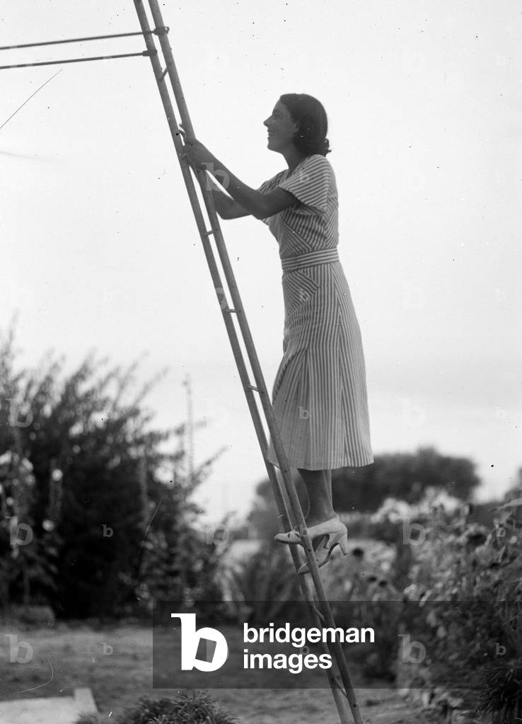 Portrait of a woman on a scale