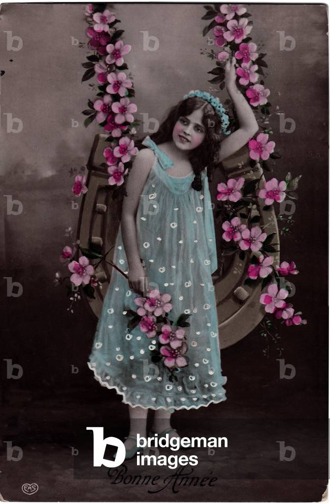 Happy Year greeting card, little girl on a flowery swing. 1909
