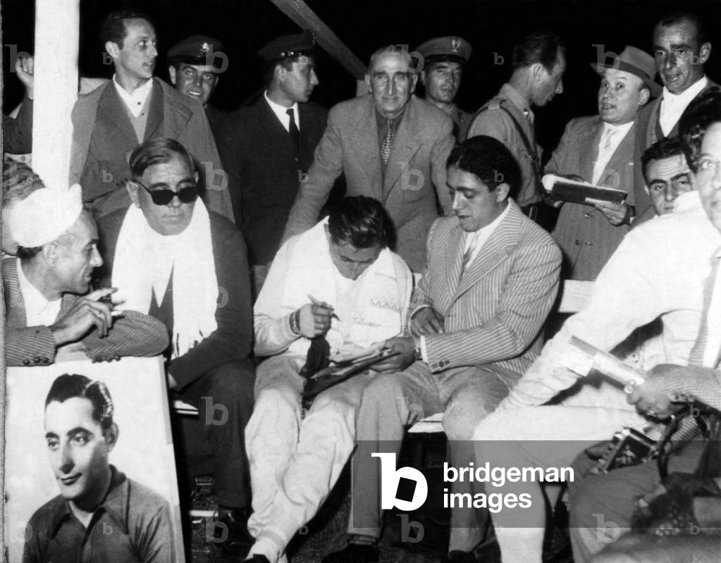 Italian cyclist Fausto Coppi (1919-1960) in Ferrara in Italy during an autograph session, 1950s