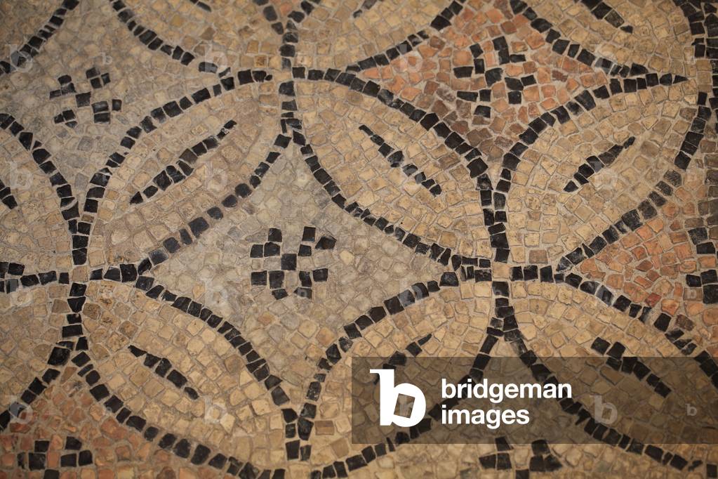 Byzantine Mosaic with geometrical patterns, from the new monument discovered over the last few decades in Ravenna : The Domus of Stone Carpets. These mosaics were part of a byzantine palace from the 6th century. Ravenna, Italy -