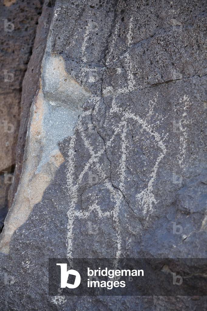Indian Petroglyphs representing a character - Petroglyph National Monument - Albuquerque, New Mexico, USA (USA)