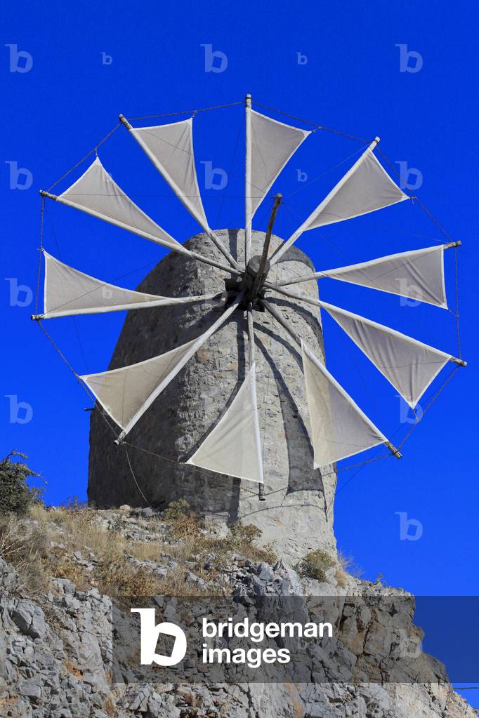 Traditional stone windmills dating back to the 1800s. Lassithi Plateau. The Lasithi Plateau, Seli Ambelou, Crete, Greece.