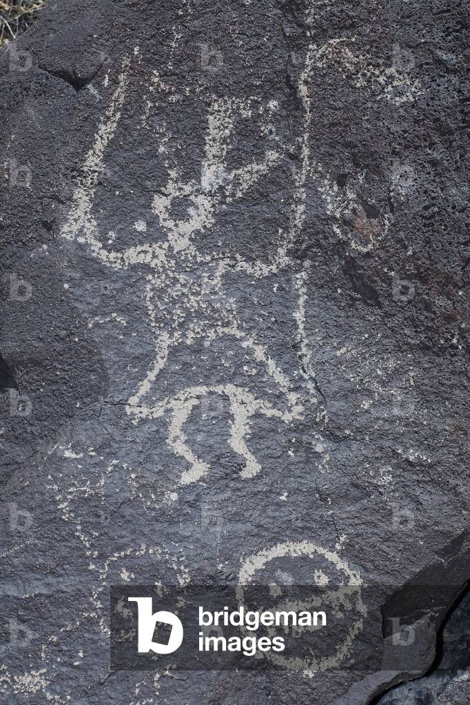 Indian Petroglyphs depicting characters and faces - Dance, Hunting or Combat Scene - Petroglyph National Monument - Albuquerque, New Mexico, USA (USA)