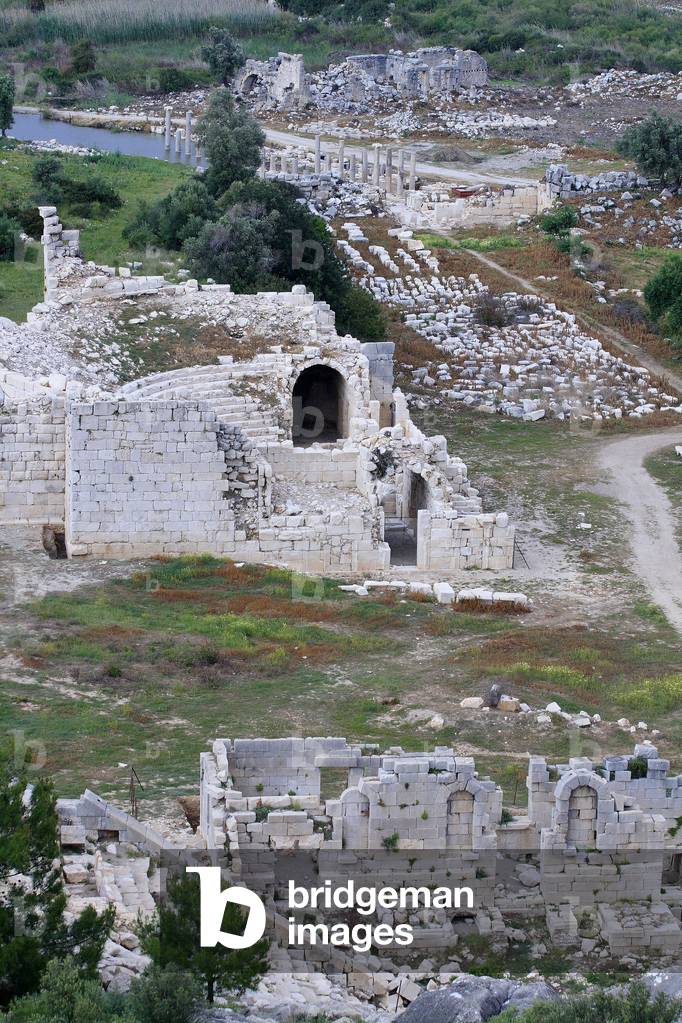 Overview of the Patara site: Stage wall of the theatre in the foreground, then the Bouleuterion, the main avenue and the thermal baths in the background/Patara/Turkey
