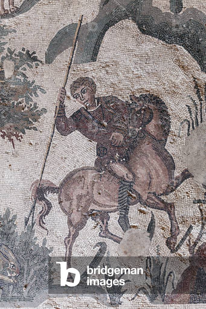 Detail of the little hunt mosaic. A hunter is about to spear a hare. 3rd - 4th century. Roman Villa of the Casale, Sicilia. UNESCO site.