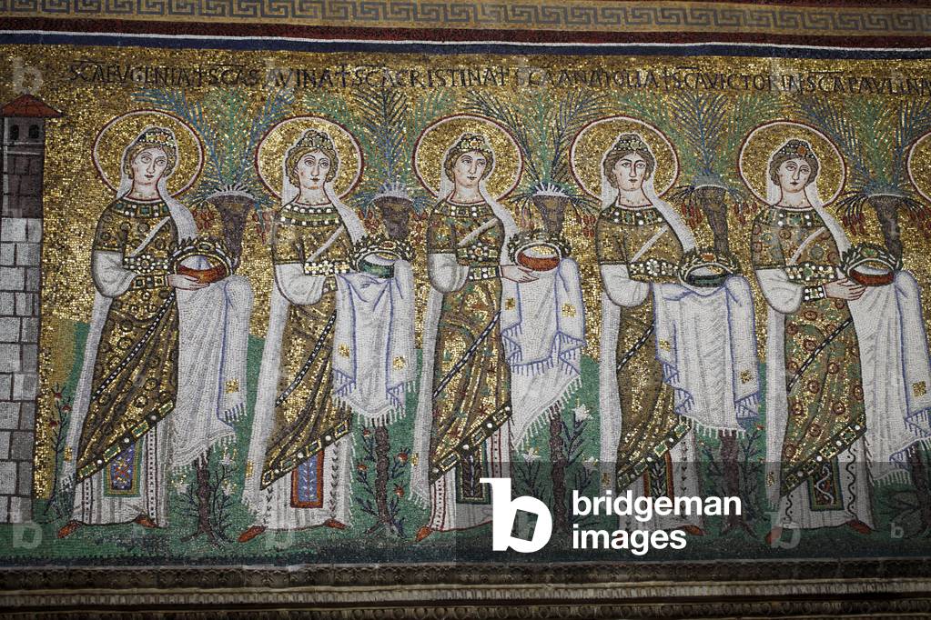 Detail of the procession of the 22 Virgins of the Byzantine period, moving from the city of Classe towards the the Madonna and Child. Byzantine mosaic from the 6th century AD. Basilica of Saint Apollinare Nuovo, Ravenne, Italy. Church inscribed on the World Heritage List -