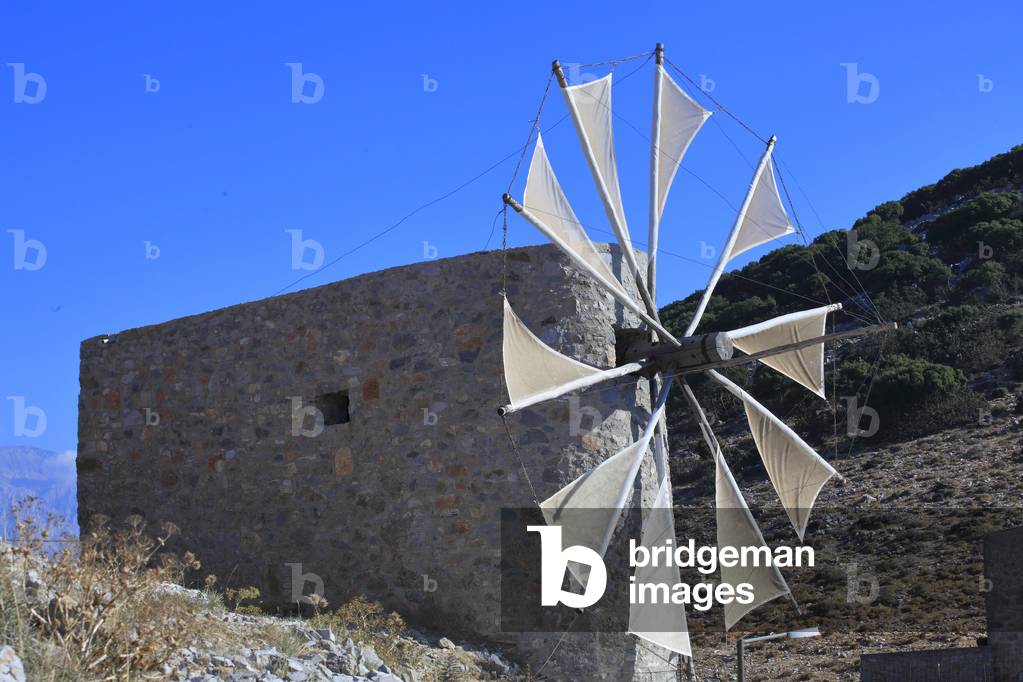 Traditional stone windmills dating back to the 1800s. Lassithi Plateau. The Lasithi Plateau, Seli Ambelou, Crete, Greece.