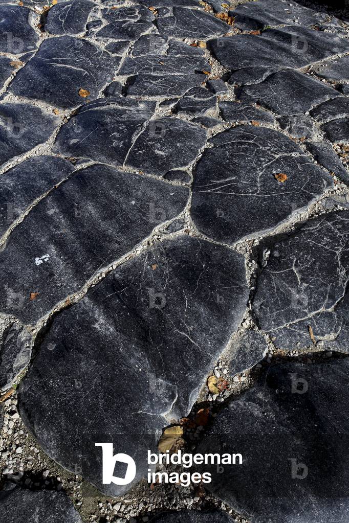Flagstone of the ancient roman paving beneath the Arch of the g