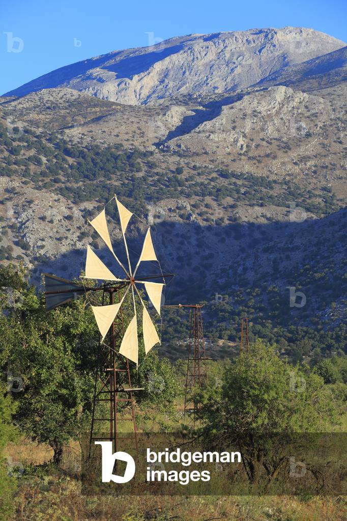 View of the Lassithi Plateau in Crete with typical windmills of the Lassithi Plateau. The Lasithi Plateau Crete , Greece.