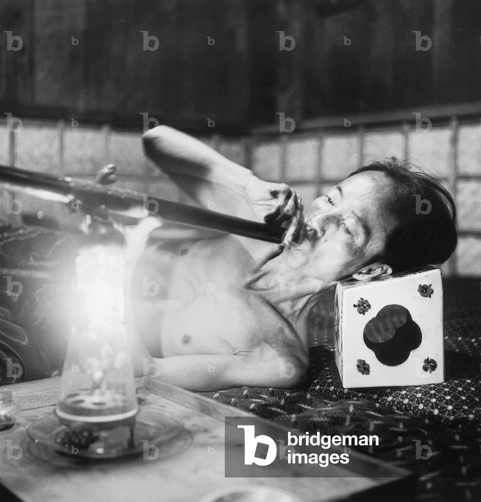opium den in hnom Penh in Cambodia in 1954 (b/w photo)