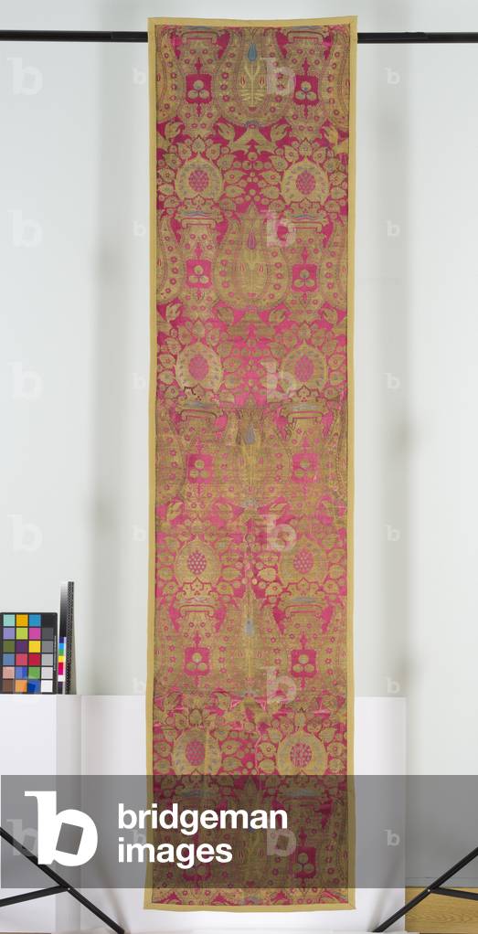 Lampas textile panel, 1550-99 (lampas, red warp-faced satin ground with pattern formed by silk wefts of light blue and yellow with fragments of the black originally used for outlining the large areas of gilt metal thread, now largely worn down to its silk core)