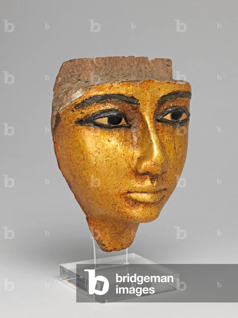 Face from a coffin, with eyes and eyebrows inlaid, gilded, 1186-1069 B.C. Twentieth Dynasty, New Kingdom (gilded wood)