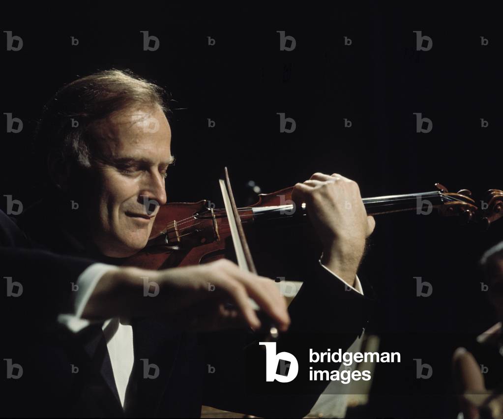 MENUHIN, Yehudi -playing violin at the Bath Festival, 1960s