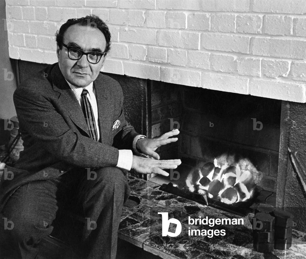 Dr Jacob Bronowski 1951 posing by coal fire while head of Coal Board Research Establishment, Cheltenham, Gloucestershire