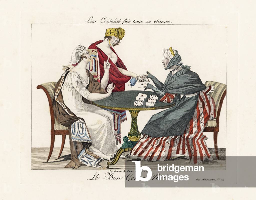 Their credulity is her only science. A fortune teller reads the cards for two credulous wonders in shawls and turbans. “The feeble minded consult this woman, whose only secret is that she has persuaded them that she knows everything.” Handcoloured engraving from Pierre de la Mesanger's Le Bon Genre, Paris, 1817.
