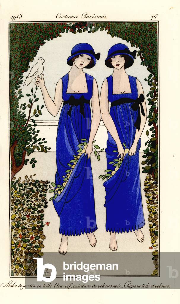 Young women in garden dresses of blue toile, black velvet belt, matching hat, with dove and flowers in a bower. Robe de jardin en toile bleu vif, ceinture de velours noir, chapeau toile et velours. Handcoloured pochoir (stencil) etching after an illustration by Marie-Madeleine Franc-Nohain from Tommaso Antongini’s Journal des Dames et des Modes, Aux Bureaux du Journal des Dames, Paris, 1913.