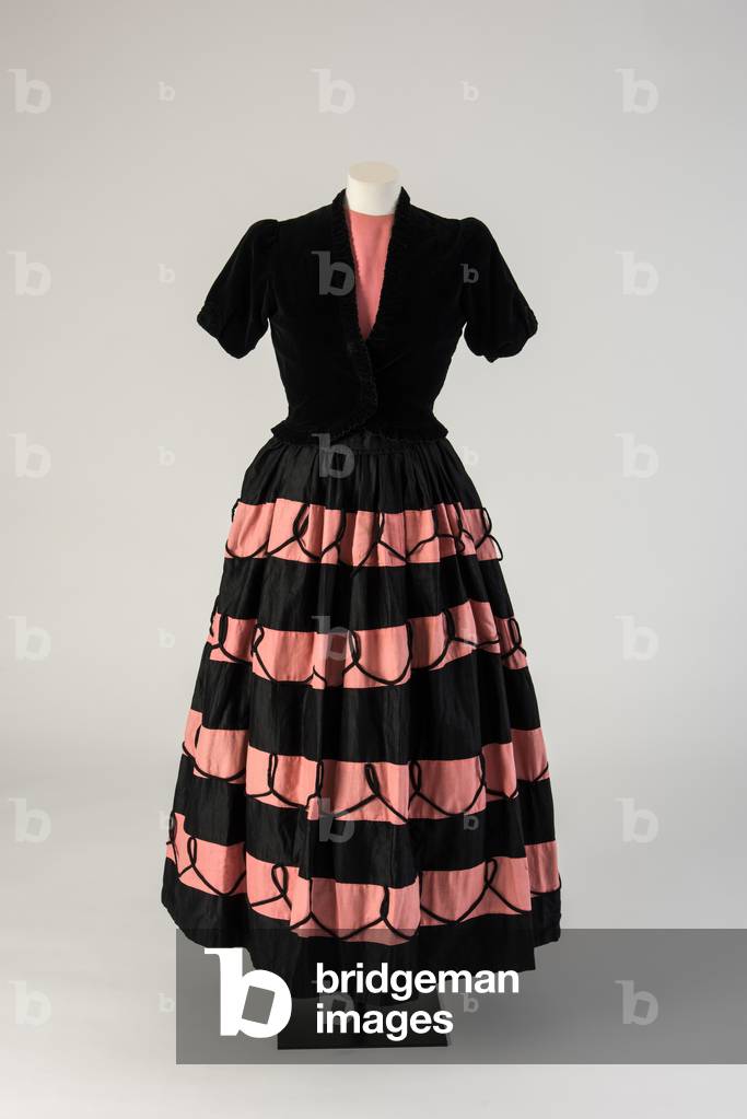 Pink and black striped skirt, made from black-out curtains, 1945 (textile)