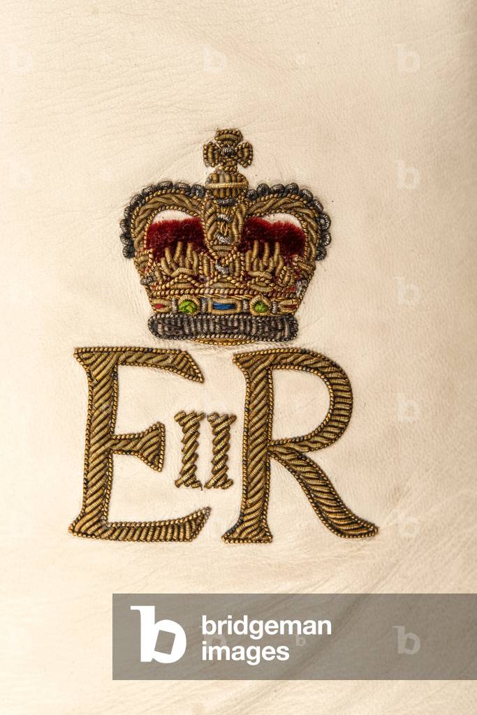 Detail of the cypher on right hand glove used at the Coronation of Queen Elizabeth II in 1953 (embroidered white kid leather with crimson silk)