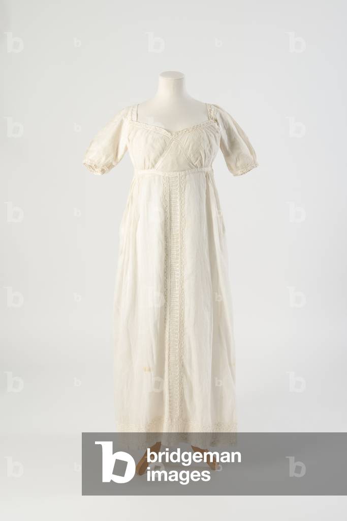 Dress of white muslin with centre front panel of white cord work embroidery in a linked oval design, c.1805 (muslin) 