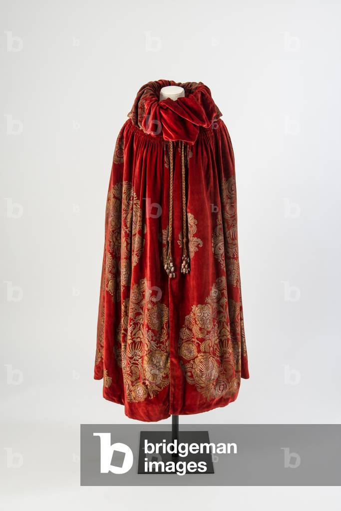Dark red velvet cloak with a gold and silver stenciled floral design and silk tassels trimmed with painted beads, c.1923 (velvet)