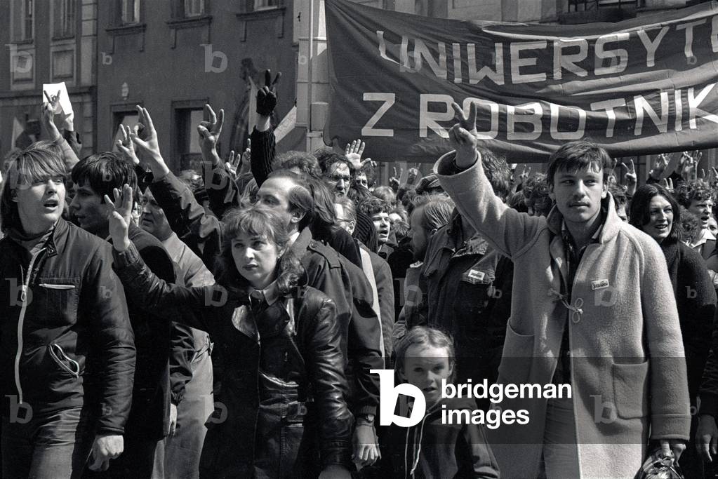 Warsaw 01.05.1982. Martial Law in Poland. Senatorska street, unofficial 1st May Solidarity parade. Banner written ' University with manual workers'. 