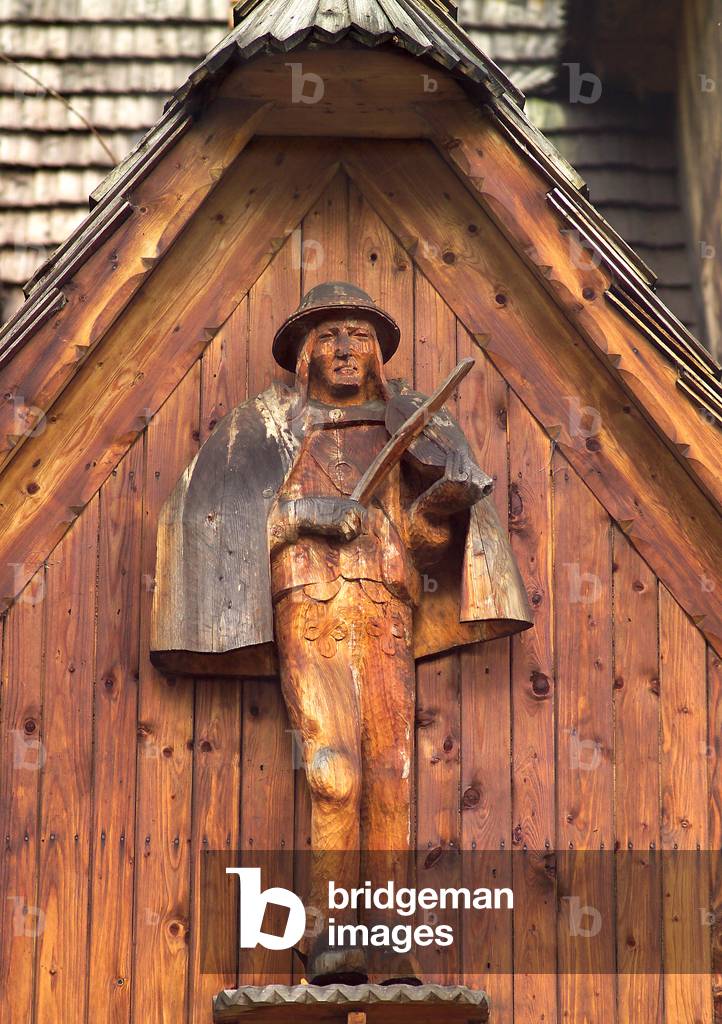 Zakopane, 16.10.2006. A statue of a highlander with his tools. 