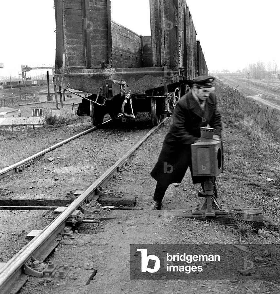 Malaszewicze, Poland, 02.1975. Railwayman operating switches at the borderline railway station. 